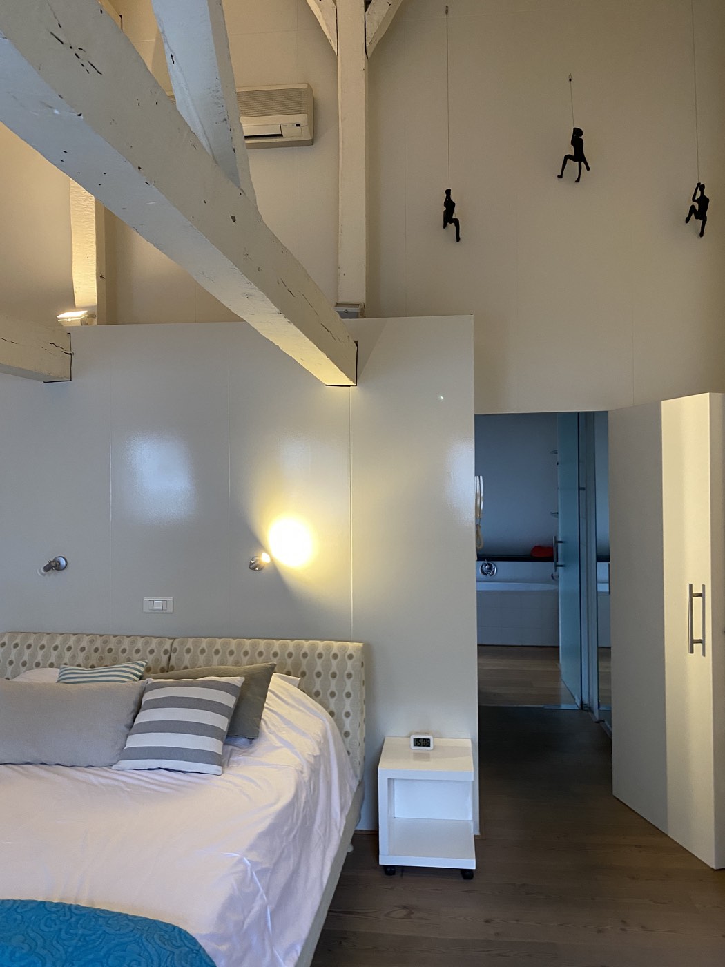 View of the bed and open bathroom in the Private Room